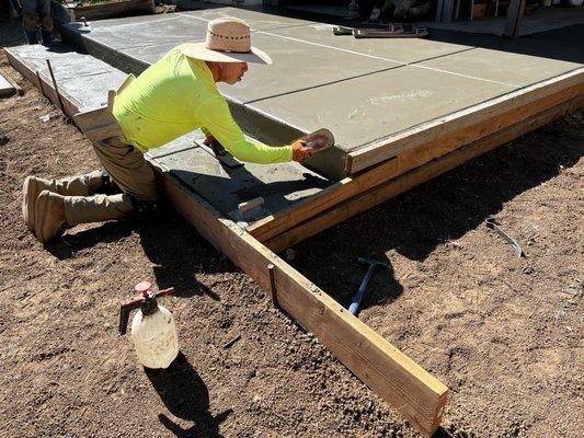 Smoothing front of new patio and step