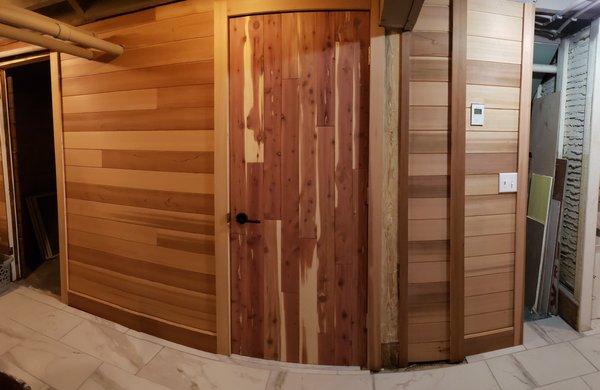 Cedar boards installed on walls and door