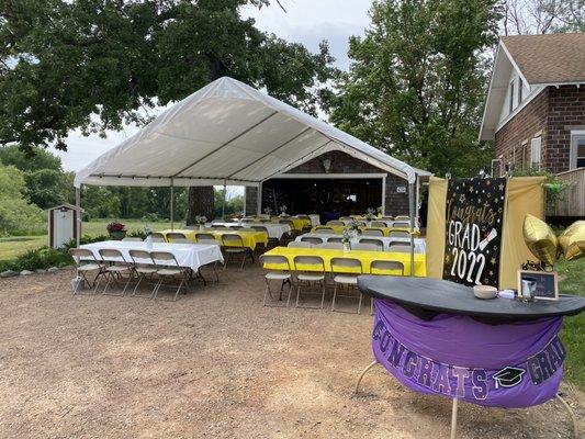 20x30 tent with ten 8' tables and 80 chairs