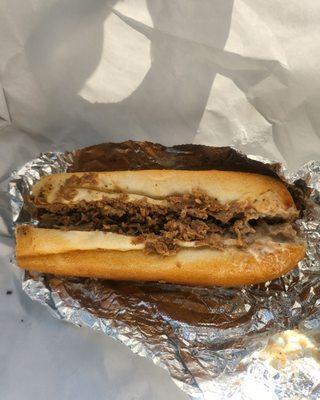 Regular Cheesesteak.  You have to pay to add onions ‍