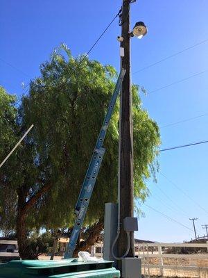 Security camera install with AP to beam the signal wirelessly to router