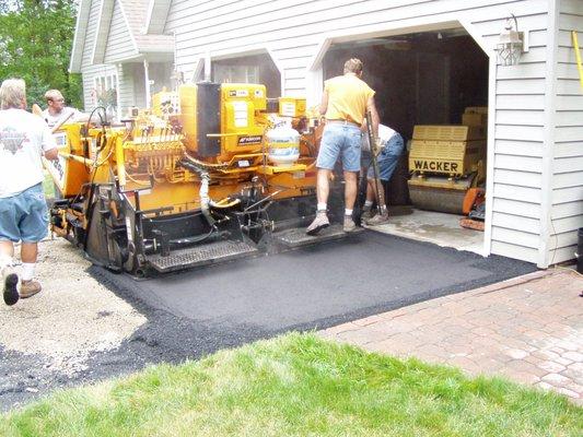 Paving residential driveway.