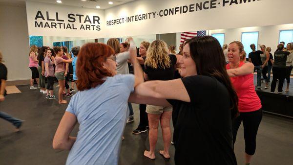 Two of our students learning how to escape a choke hold during one of our women's self defense class!