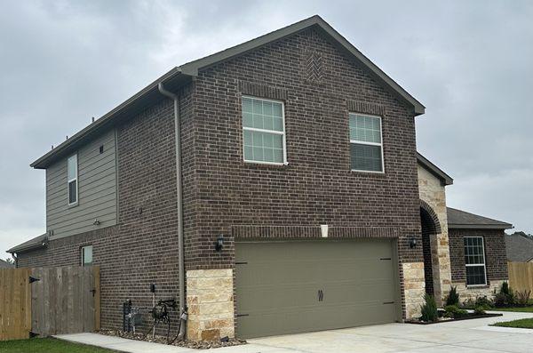 Beautiful two story home protected from hard water by our RainMizer Seamless Gutters!