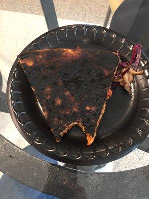 Pizza that has been incinerated rather than baked.