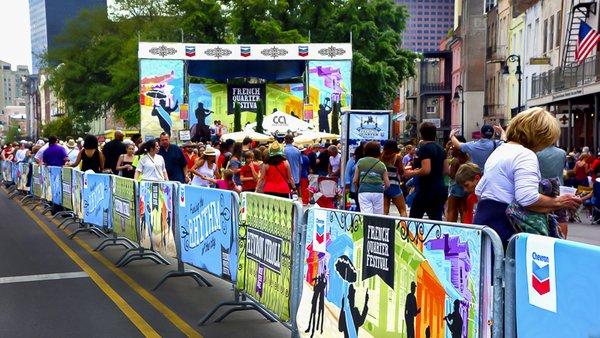 Backdrop, banners, stage scrim and barricade covers for French Quarter Festival, made by CCI Productions.