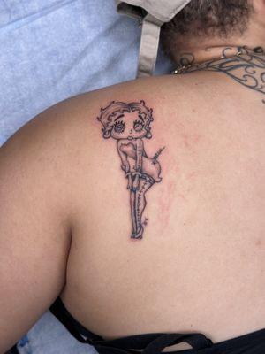 Signature voodoo doll fine line tattoo