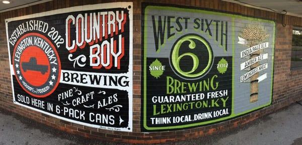 Hand painted advertisements by a local artist for local beer companies