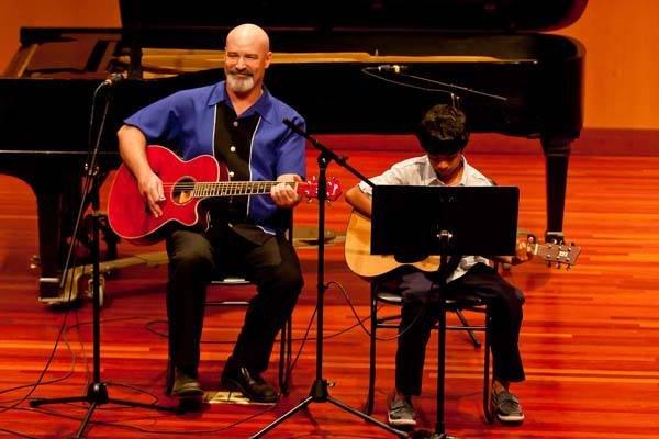 Our guitar teacher Mike Osborn during our seasonal recitals