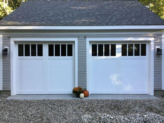 Fimbel smooth steel carriage house garage doors with vinyl overlays and tall 4 pane windows in Forestdale