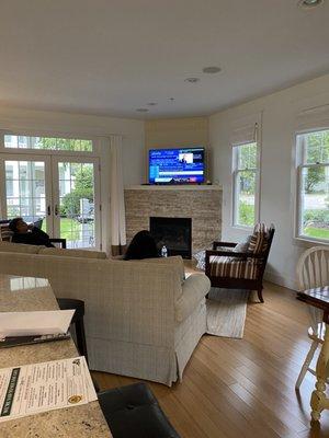 Living room/great room with beautiful fireplace, French doors to the cozy patio.