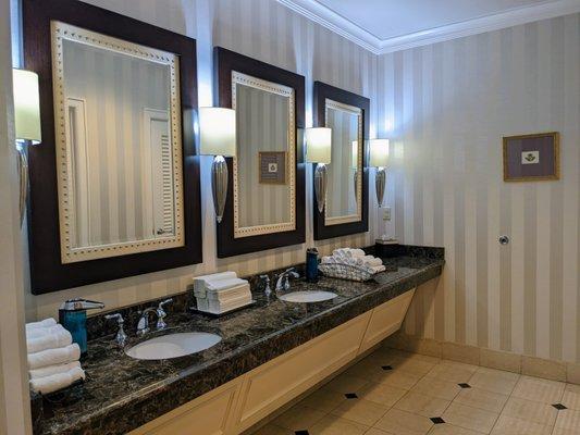 Inside the men's restroom on the 2nd floor of the clubhouse. Sink area.