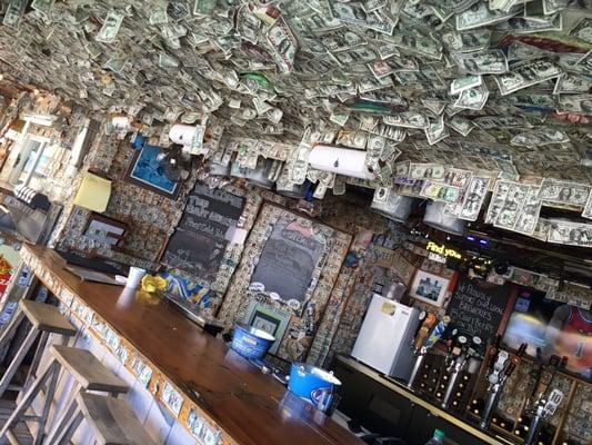 Bar and food with dollars on the ceiling.