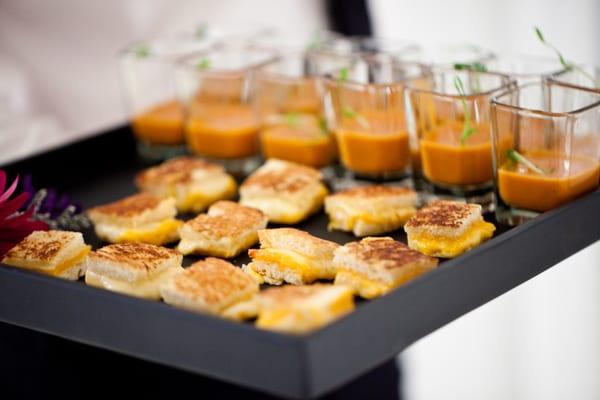 Mini Grilled Cheese Sandwiches accompanied by a creamy roasted tomato and basil soup shooter