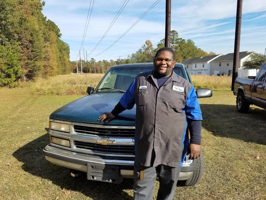 Class 'A' Automobile Technician "Clinton" standing with his favorite  brand of truck