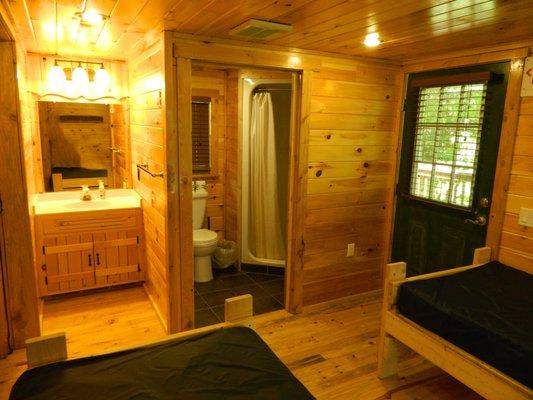 Rear bedroom/bathroom of cabin with front kitchenette