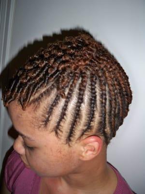 Natural Hair-Flat twists to the scalp on the sides and back of head. Single twist applied to the top front of head.