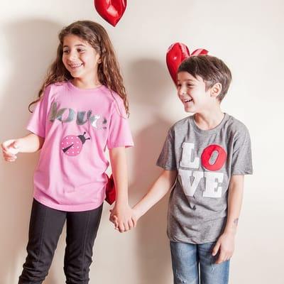 My daughter posing with her Valentine's shirt from Lil Threadz