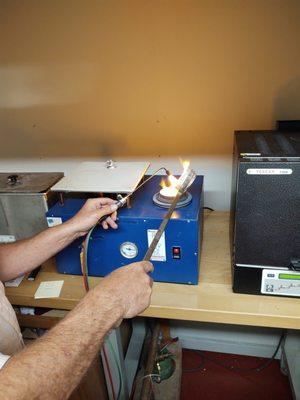 Pouring gold into cast of rings