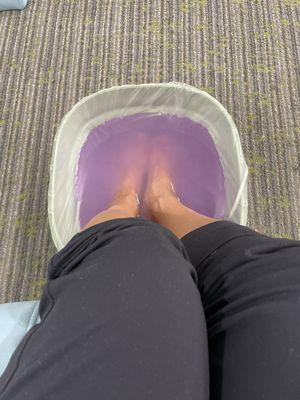 I was a little thrown off by the portable bucket at the beginning, I'll admit, but Monica did a great job buffing my feet.