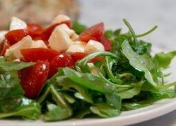 Rocket Salad: Fresh chopped grape tomato and mozzarella on a bed of arugula