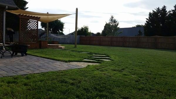 Paver patio, flagstone paver pathway, and shade sail