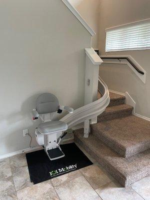 A curved rail stairlift we installed recently. Our customer was so happy the first time she used it she giggled!