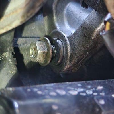 Alternator mounting bolt, obviously it isn't even fully tightened.