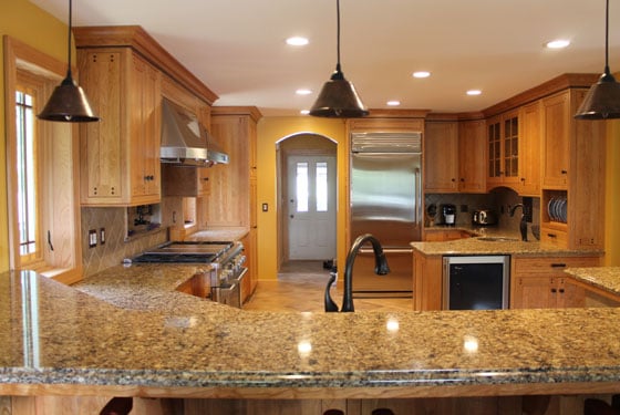 Arts and Crafts style kitchen with walnut peg detailing.