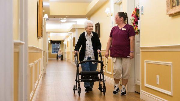 Caregiver Assisting a Resident at Kingston Residence of Marion