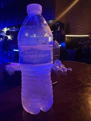 $3.50 water in an empty hookah lounge on a Tuesday