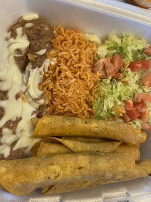 Beef or chicken Flautas with guacamole and sour cream.