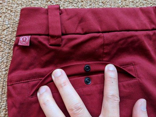 Commission Short 9 Slim Chino. Rear left pocket, button-up. Rear right pocket is zip-up. Color: Ox blood.