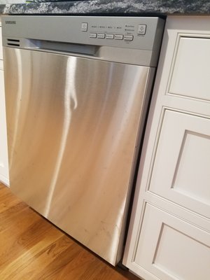 Our brand-new dishwasher with a dent, courtesy of Legacy Construction, East Greenwich, RI.