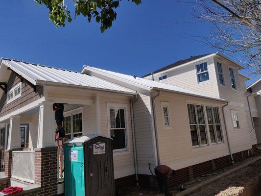 Galvanized gutters installed to metal roof