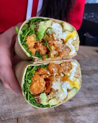 BEYOND BREAKFAST BURRITO - 3 fried eggs, beyond sausage,  white american cheese, tater tots, spicy basil aioli, arugula, tomato, and avocado