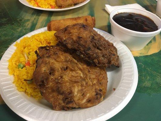 Egg Foo Young with a very dark gravy.