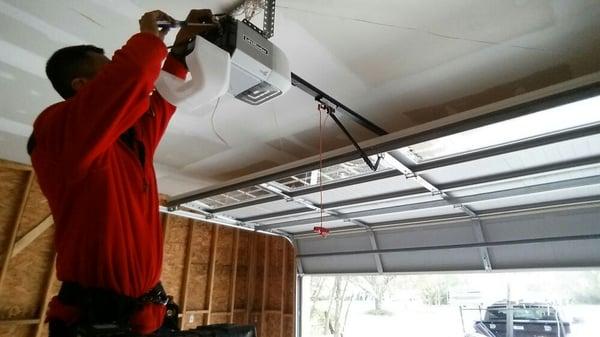 Install garage doors and openers.