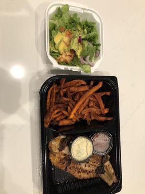 Blackened catfish with sweet potato fries and a salad