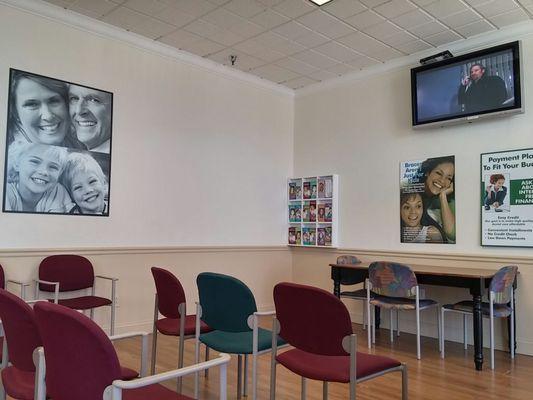 Clean waiting room with TV