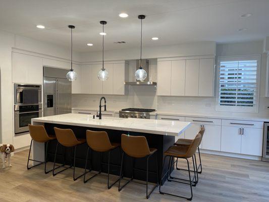 New island, refaced all cabinets and drawers, added backsplash and lighting.