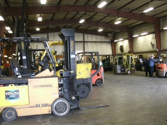 Forklifts in the process of being repaired in our Boyertown shop.