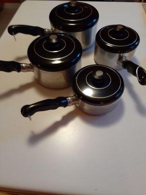 Vintage and near mint saucepans.