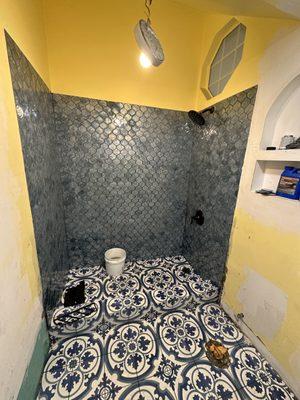 Removed tub and continued the tiles to make a standing shower.