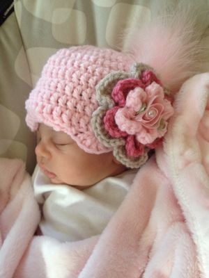 Marcy is cosy in her crocheted cloche.