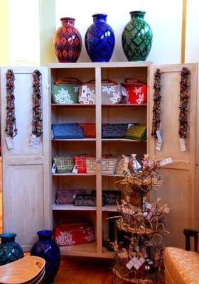 A few of our items includes pottery from Morocco, necklaces from Indonesia, bags from India, and candles from Thailand