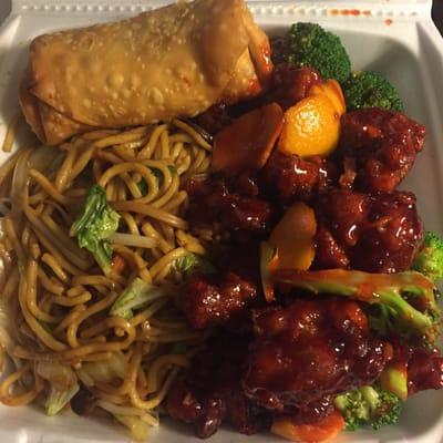 Orange chicken combination with vegetable Lo mein and a pork egg roll