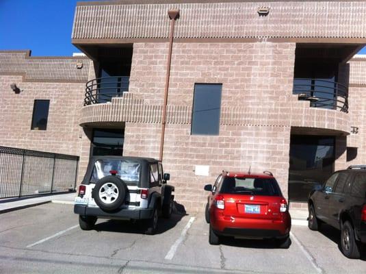 The door on the left is the entrance from the small driveway.