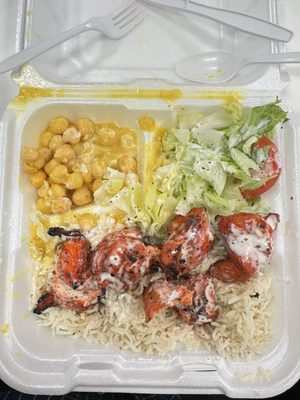 Chicken kabob (mild) over rice with chickpeas and salad. $13. Delicious and super filling.