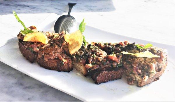 Wagyu Beef Tartare Toast: Charred tomato, olive, leek sauce, potato chip